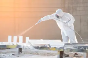 A man working on epoxy flooring for business