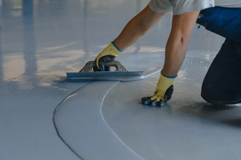 Worker applying one of the best epoxy products