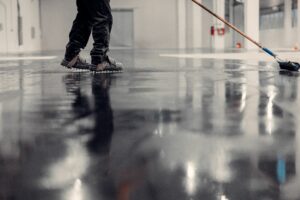 Epoxy floor coating in an industrial warehouse.